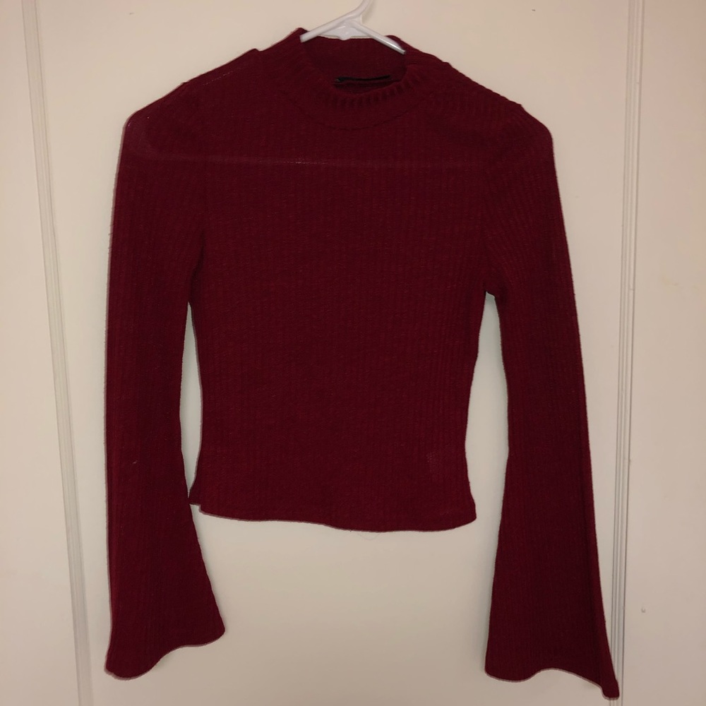 Mock turtleneck with fluted sleeves